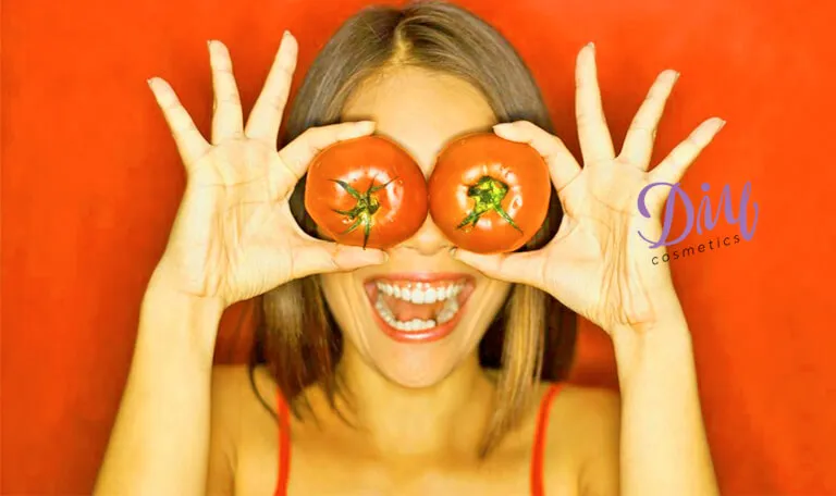 27809 woman applying tomato mask